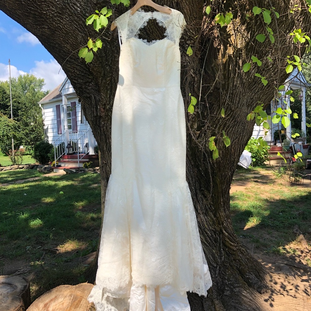 NWT. Never worn. Lace wedding gown.